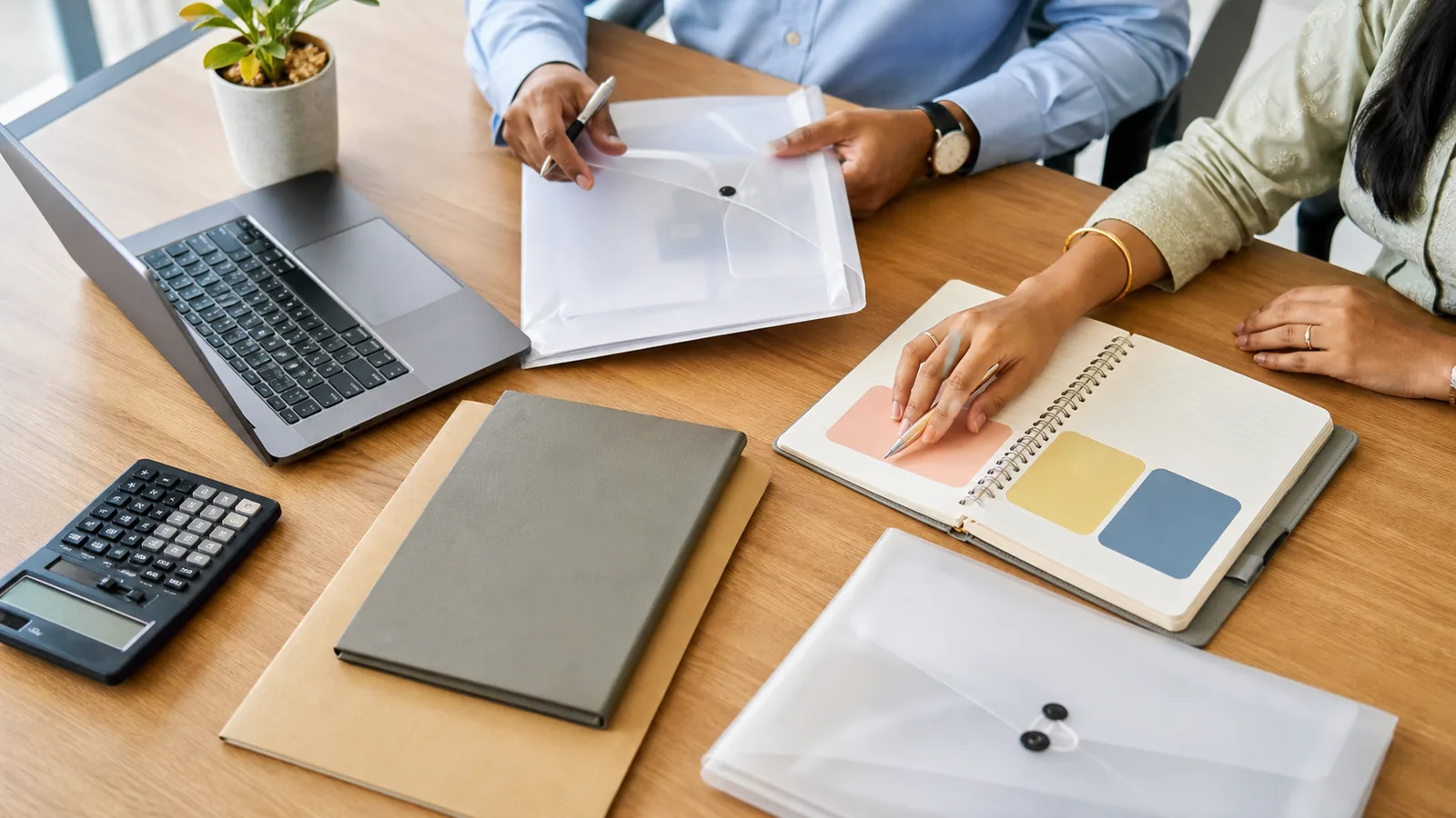 Professionals arrange tax-regime, lock-in and long-term-goal documents on a clean office desk before choosing an ELSS investment.